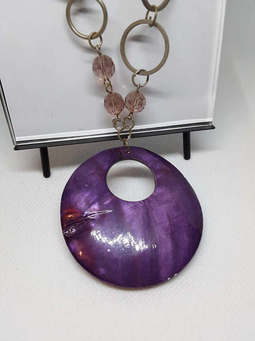 Silvertone circle necklace with purple pendant