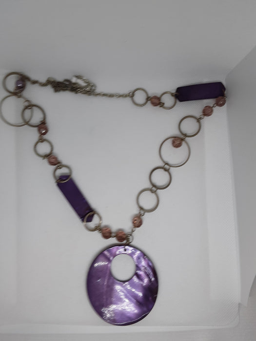 Silvertone circle necklace with purple pendant